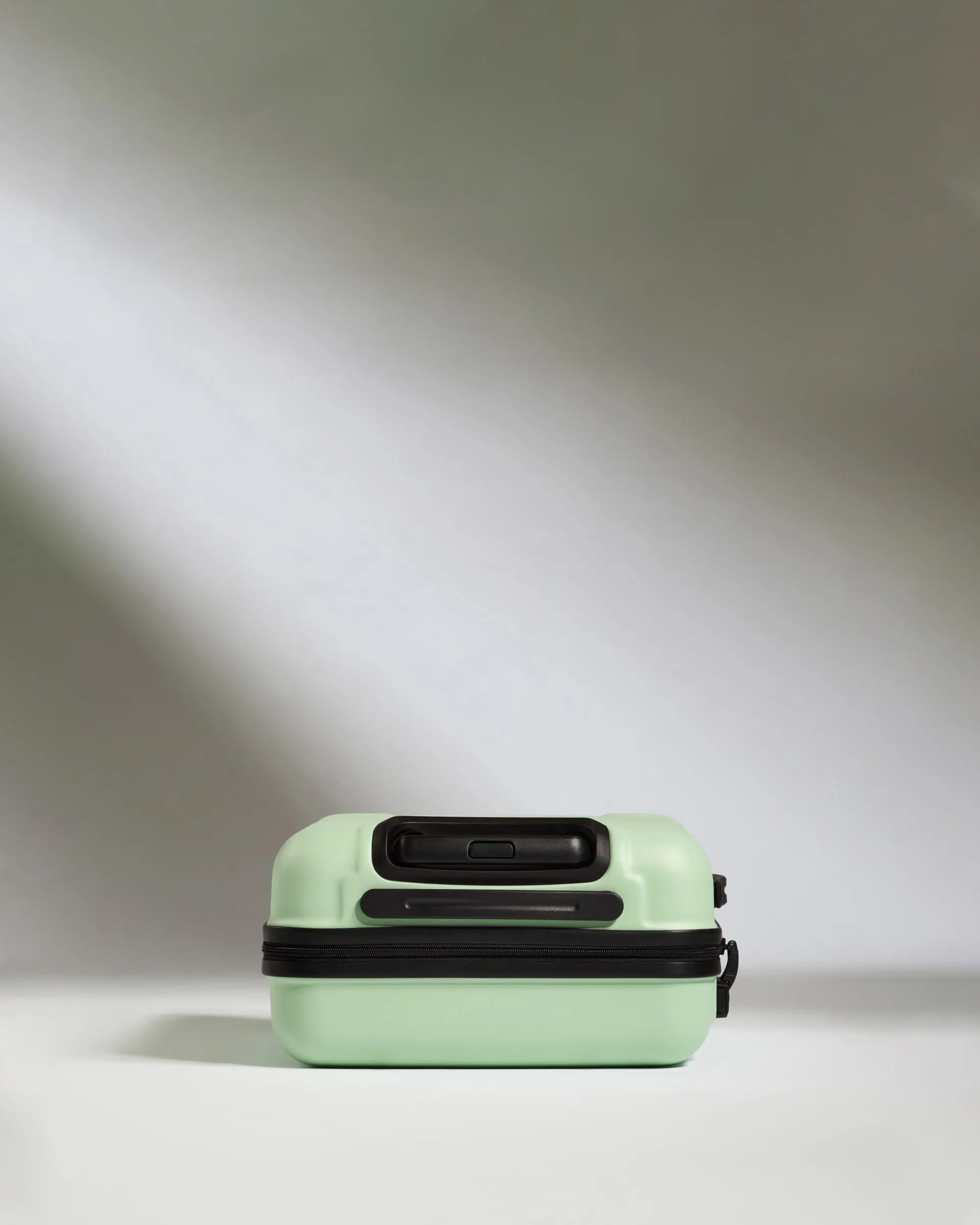 Cabin Suitcase in Aspen Green - Logo