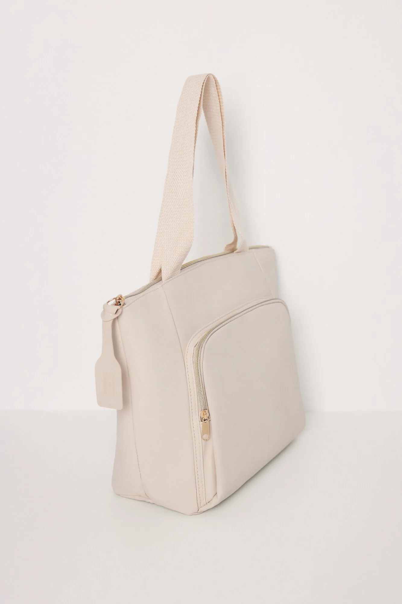 Large beige rubberized bag