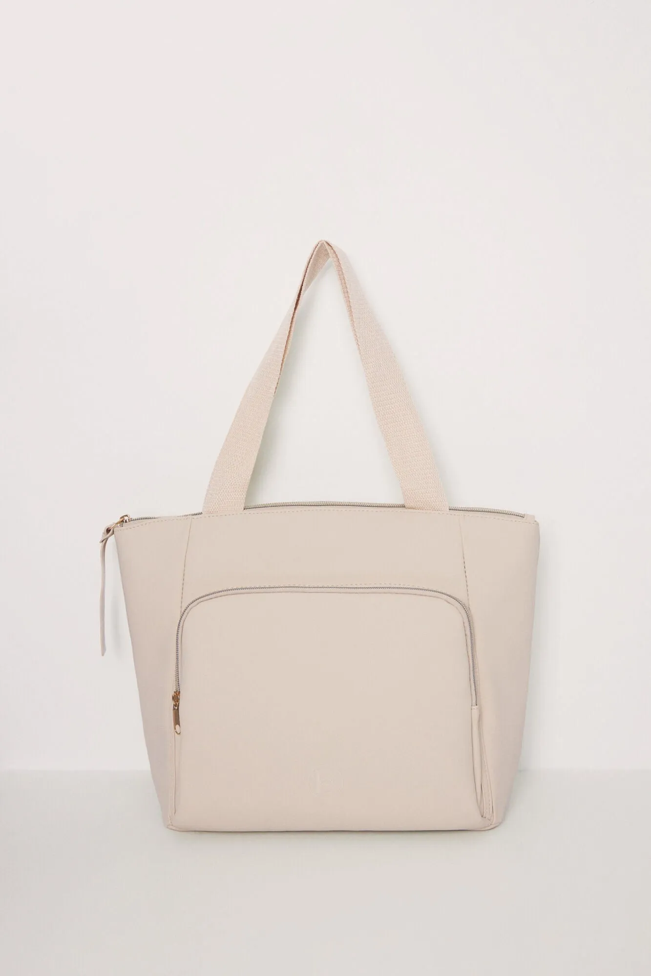 Large beige rubberized bag