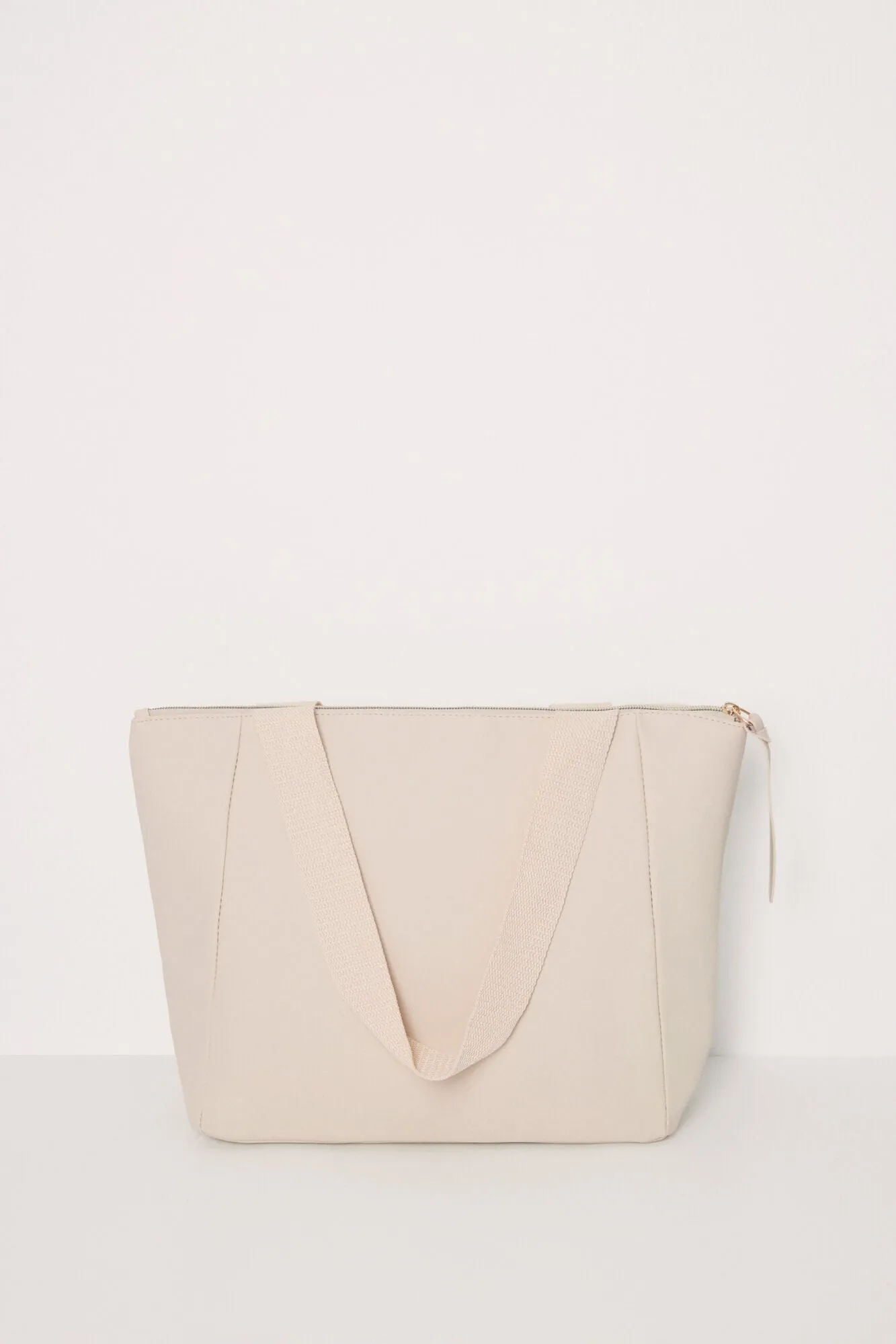 Large beige rubberized bag