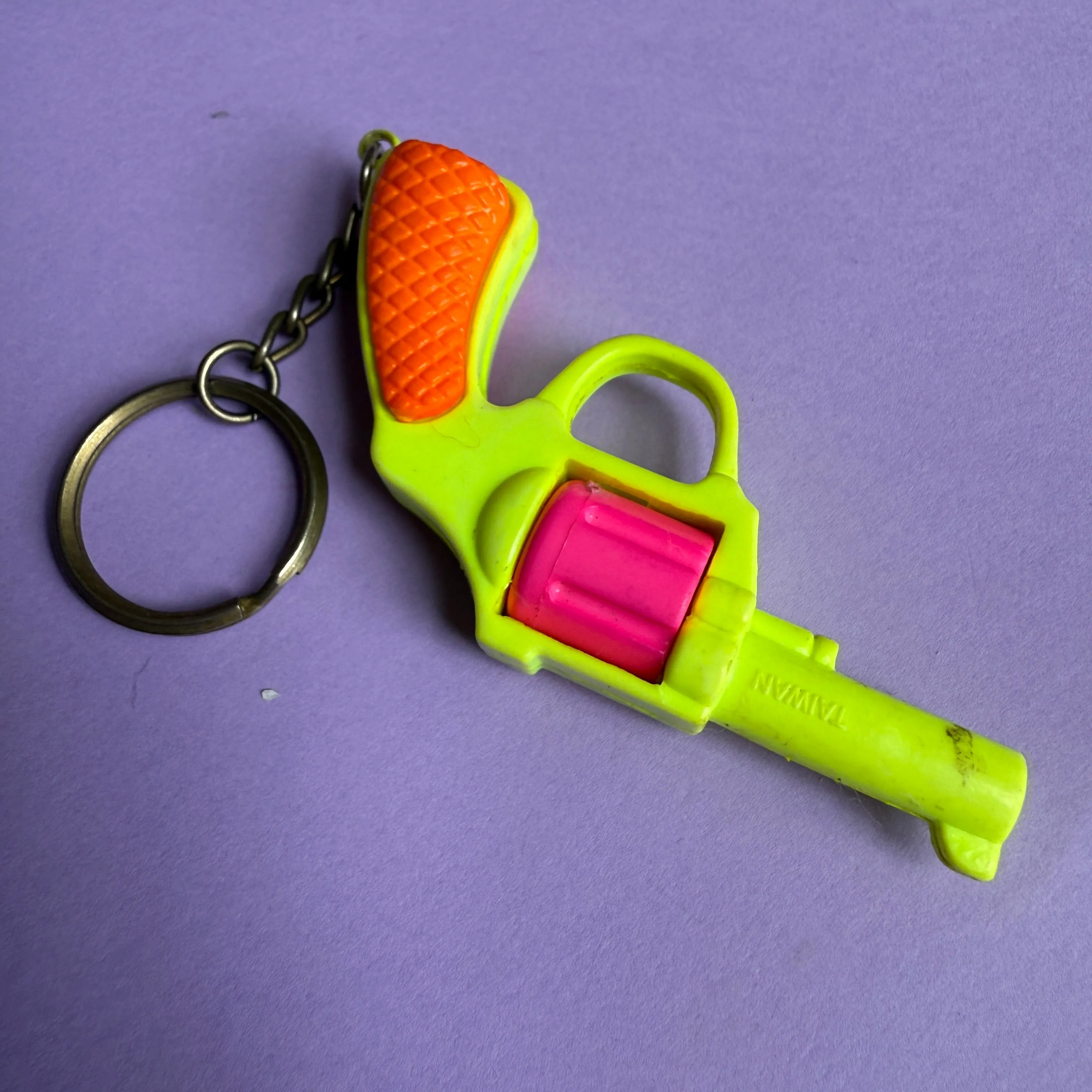 Neon 80s plastic gun charm