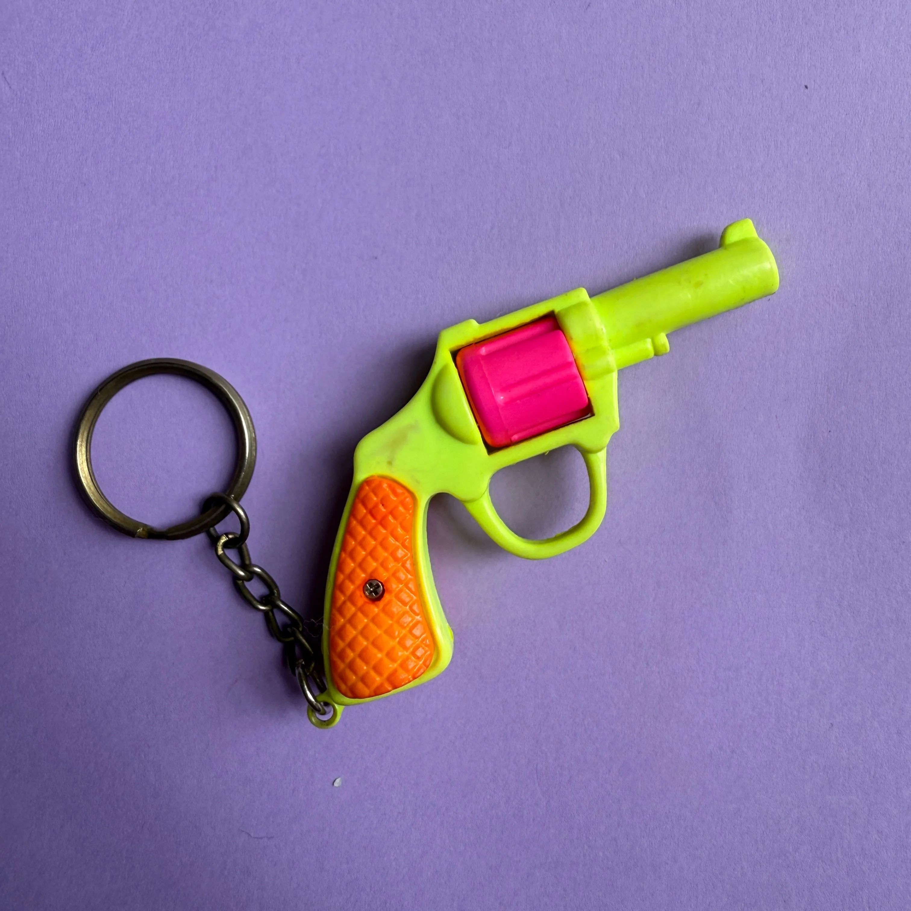 Neon 80s plastic gun charm