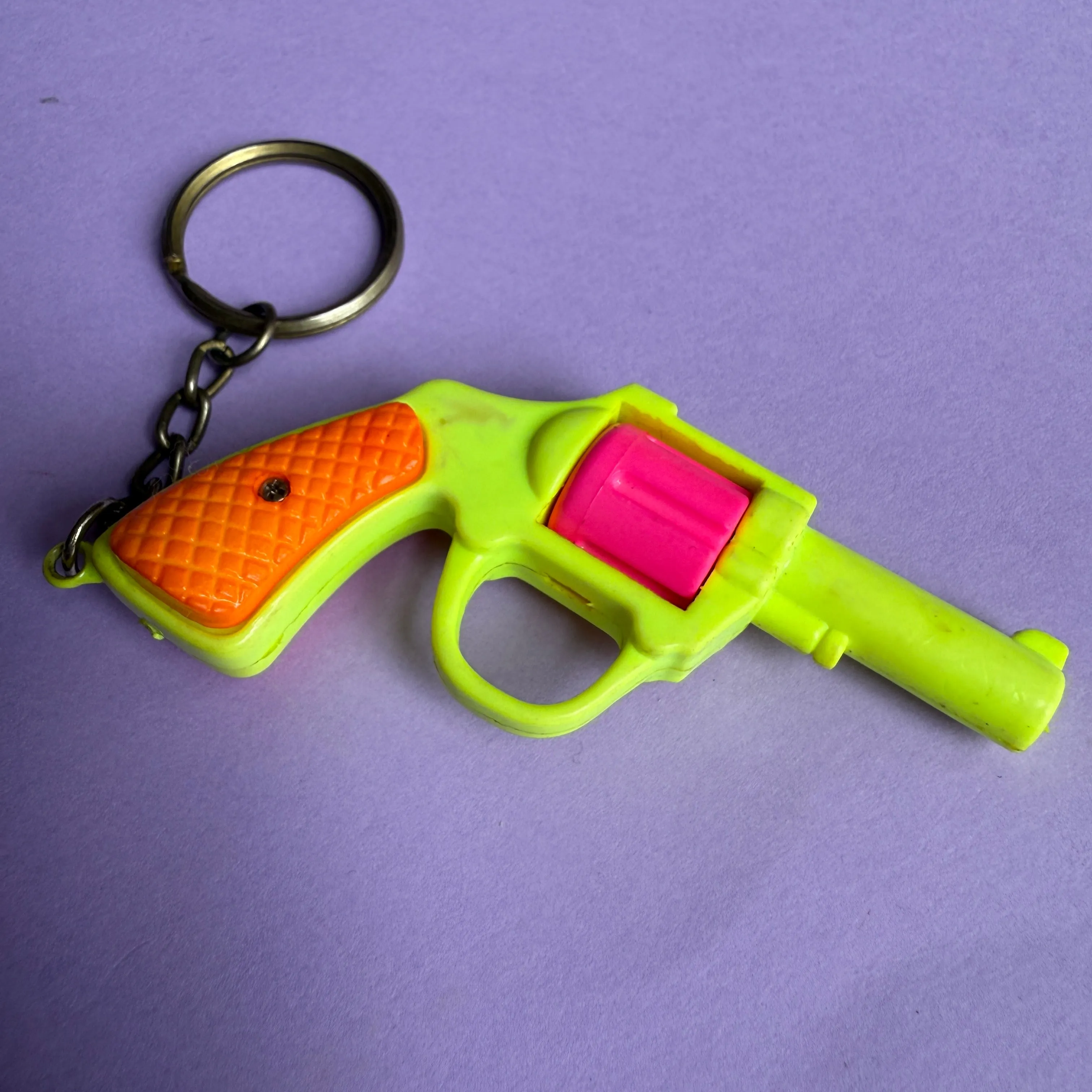 Neon 80s plastic gun charm